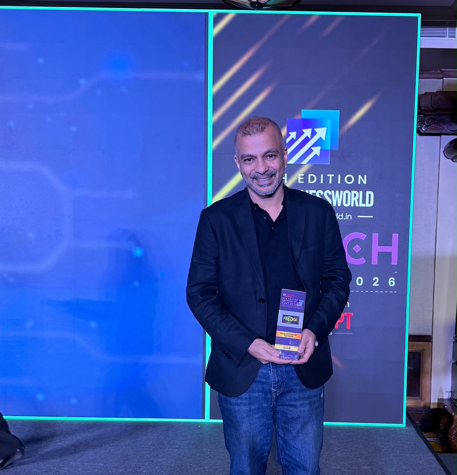 Mayank Bhatnagar, Co-Founder and COO of FinEdge, holding the Gold trophy for WealthTech of the Year at the 6th Edition BW Festival of FinTech 2026